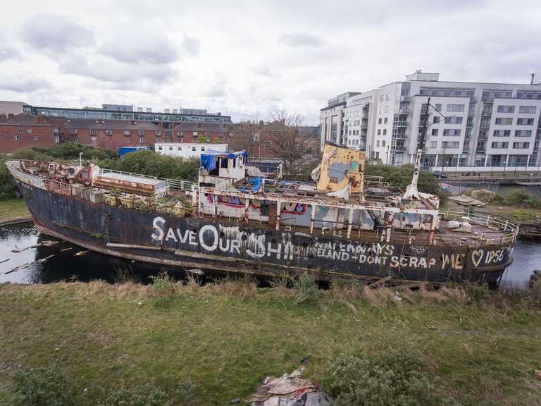 Calls to restore historic MV Naomh Eanna which is capsized in Grand Canal Dock Calls to restore historic MV Naomh Eanna which is capsized in Grand Canal Dock